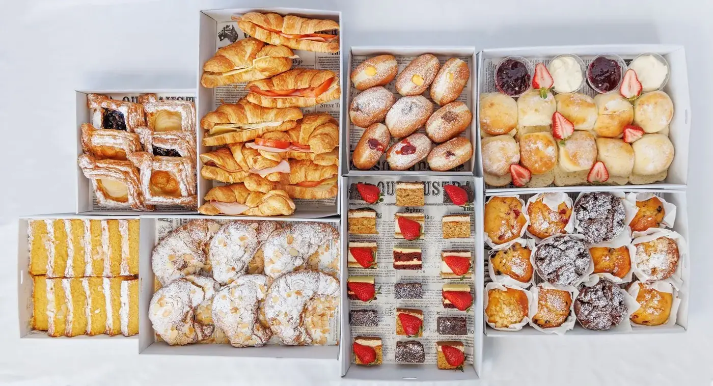 Bakery catering boxes of muffins, scones, slices, danishes and sweet treats